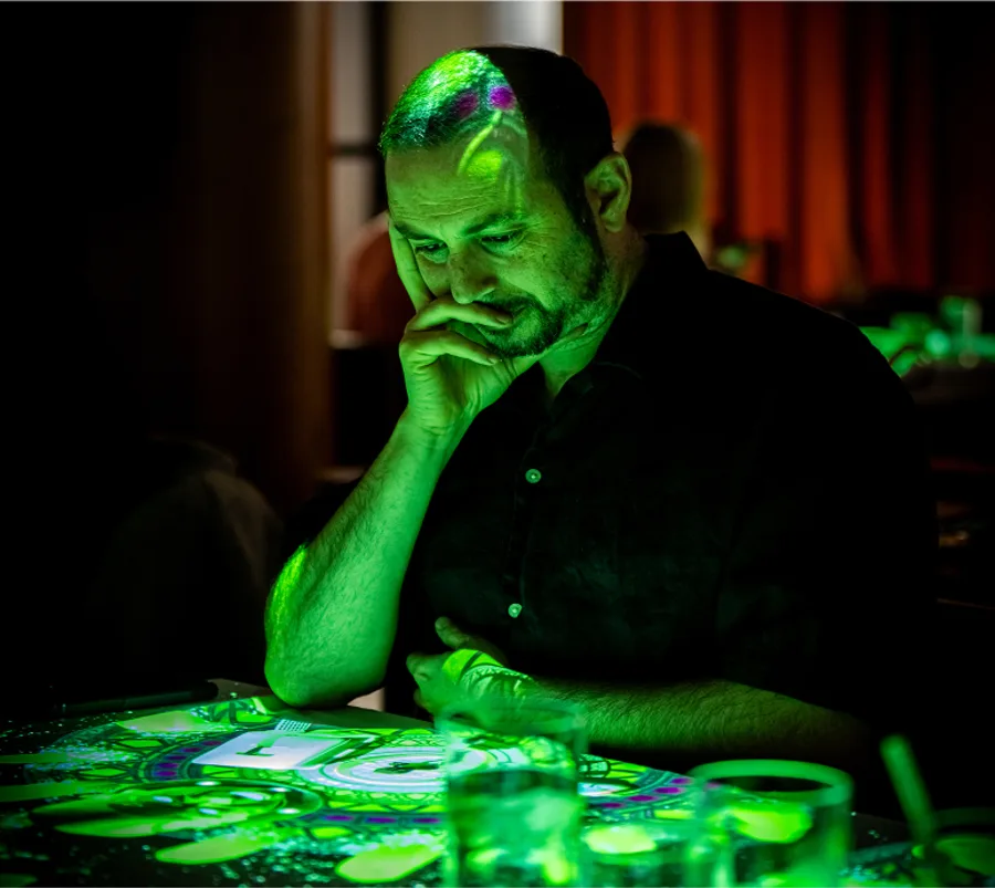 A man sitting by the table