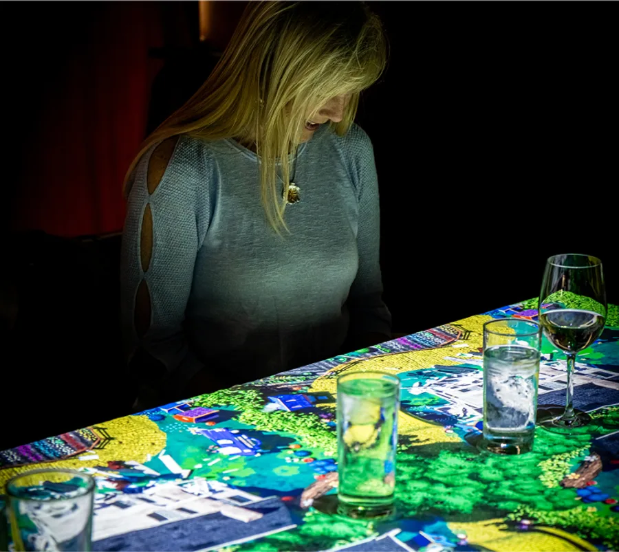 A woman sitting by the table