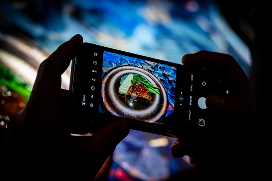 A zoom of a mobile phone taking a photo
